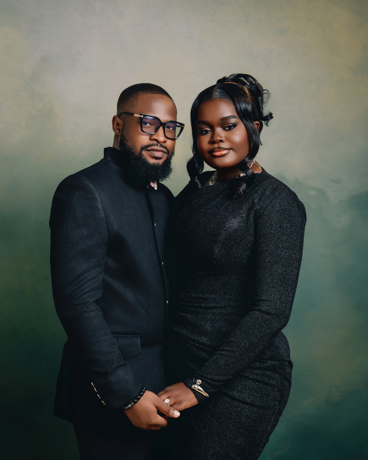 Formal portrait, hands intertwined